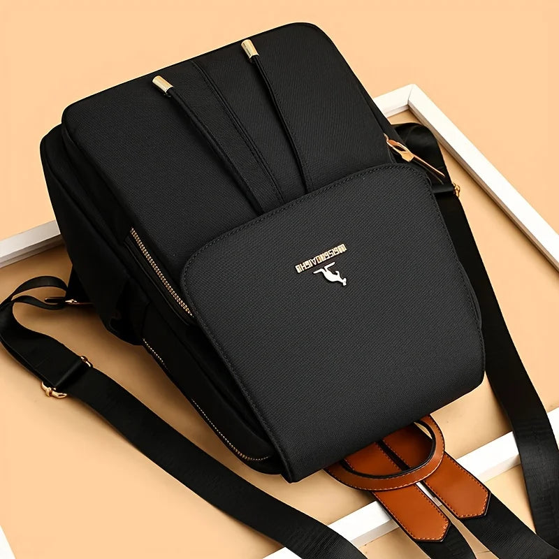 Modischer Damenrucksack mit großem Fassungsvermögen |   Leichtgewichtig, Verstellbare Schultergurte, Strapazierfähiges Futter, Reißverschluss, Schwarz mit weißem Logo, Perfekt für Reisen & den täglichen Weg zur Arbeit,